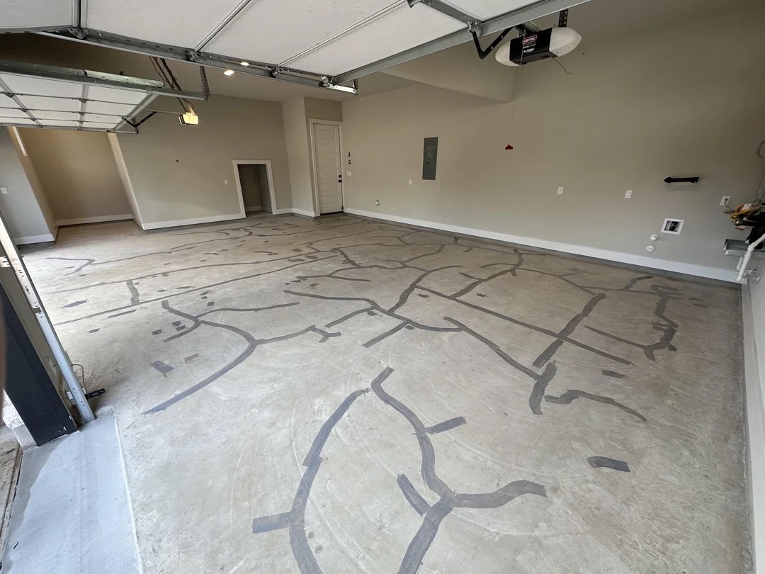 Bare concrete garage floor before coating