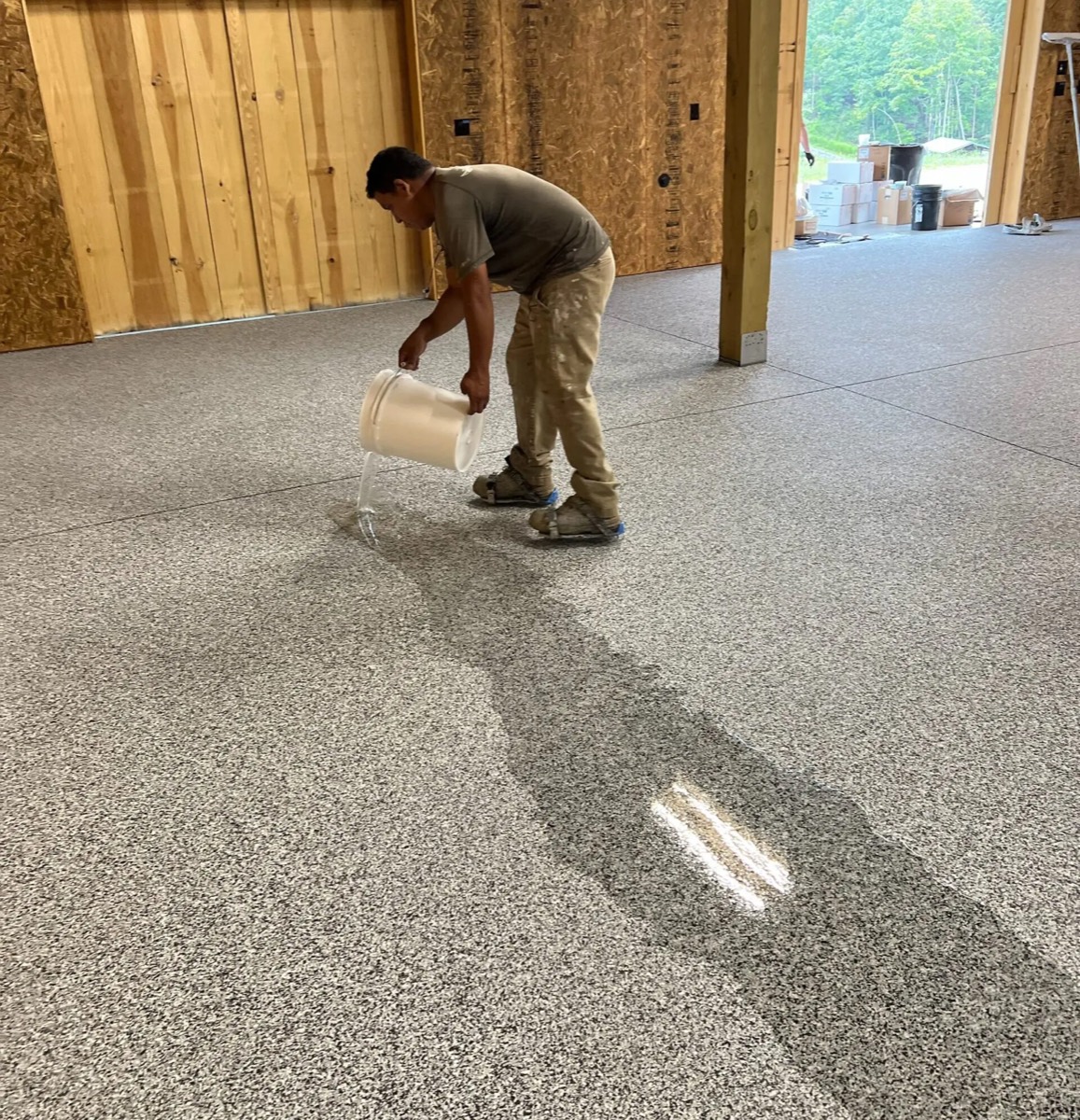 Kraken crew broadcasting decorative flake into epoxy